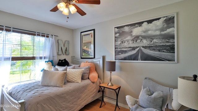 bedroom with hardwood / wood-style floors and ceiling fan