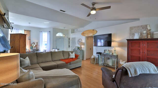 living room featuring light hardwood / wood-style floors, ceiling fan, and lofted ceiling