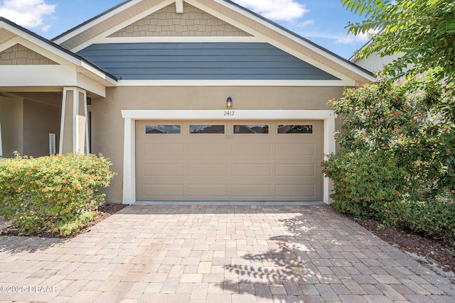 2412 Regency Park Dr, Deland, FL 32724 - garage with decorative driveway