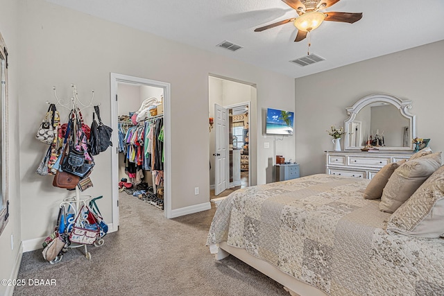 2412 Regency Park Dr, Deland, FL 32724 - carpeted bedroom featuring a spacious closet, a closet, baseboards, and ceiling fan