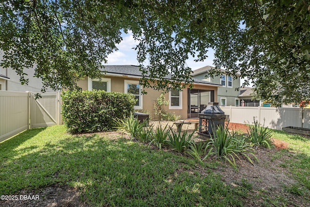 2412 Regency Park Dr, Deland, FL 32724 - back of house with stucco siding and a gate