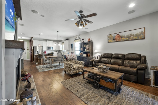 2412 Regency Park Dr, Deland, FL 32724 - living area with ceiling fan, dark wood finished floors, recessed lighting, and baseboards