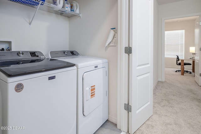 58 Bella Oaks Dr, Port Orange, FL 32129 - laundry room with washer and dryer and light colored carpet