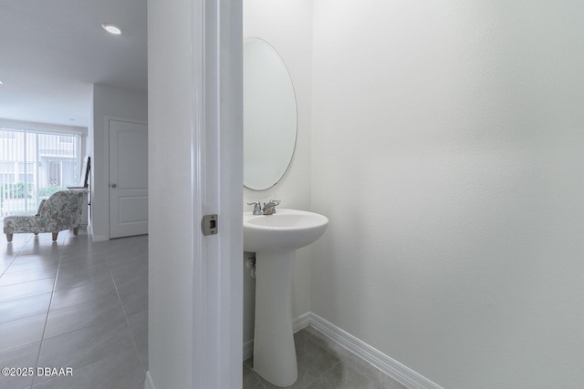 58 Bella Oaks Dr, Port Orange, FL 32129 - bathroom featuring a sink and tile patterned flooring