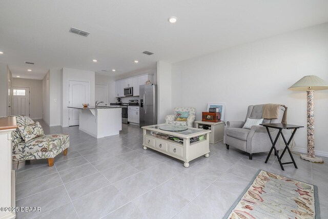 58 Bella Oaks Dr, Port Orange, FL 32129 - living area with light tile patterned floors and recessed lighting