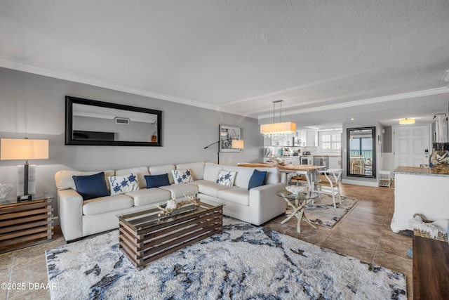 5499 S Atlantic Ave, New Smyrna Beach, FL 32169 - living area featuring ornamental molding and a textured ceiling