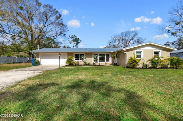 ranch-style home featuring a garage and a front lawn