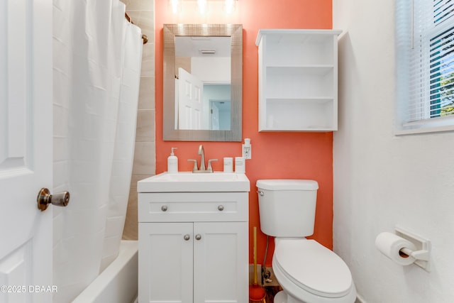 bathroom featuring vanity, toilet, and visible vents