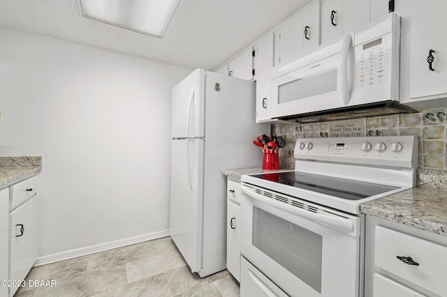 3600 S Ocean Shore Blvd # 111, Flagler Beach, FL 32136 - kitchen featuring white cabinets, tasteful backsplash, baseboards, and white appliances