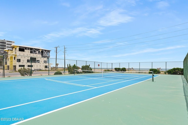 3600 S Ocean Shore Blvd # 111, Flagler Beach, FL 32136 - view of tennis court with fence and community basketball court