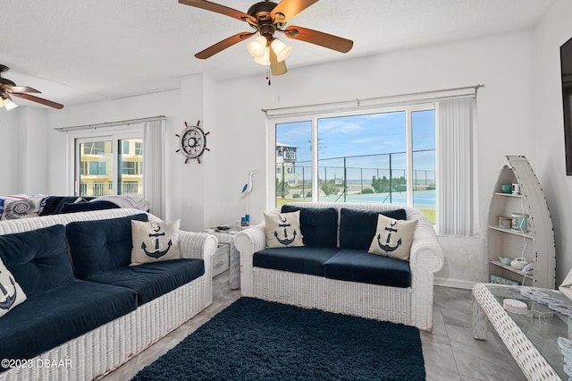 3600 S Ocean Shore Blvd # 111, Flagler Beach, FL 32136 - living room with plenty of natural light and a ceiling fan