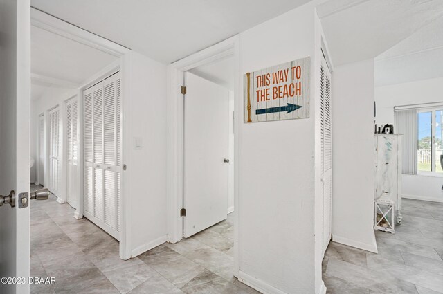 3600 S Ocean Shore Blvd # 111, Flagler Beach, FL 32136 - hallway with baseboards