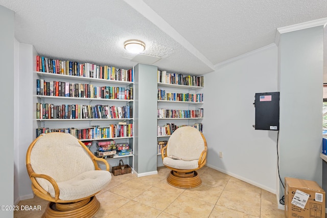 3600 S Ocean Shore Blvd # 111, Flagler Beach, FL 32136 - living area featuring tile patterned floors, crown molding, a textured ceiling, and baseboards