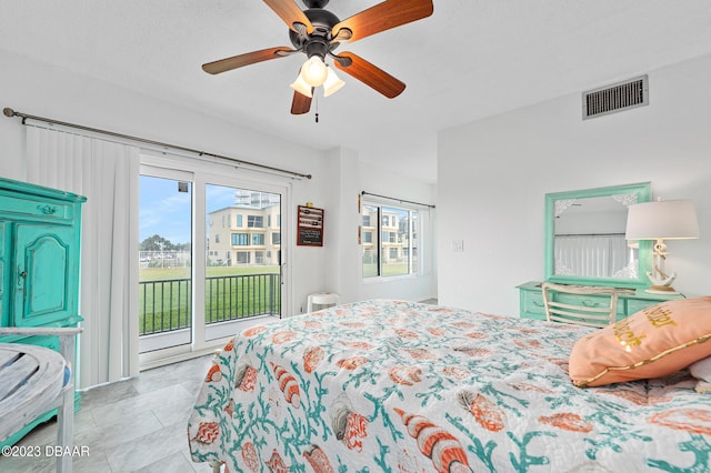 3600 S Ocean Shore Blvd # 111, Flagler Beach, FL 32136 - bedroom with multiple windows, a ceiling fan, visible vents, and access to exterior
