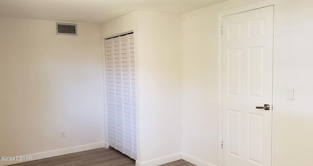 unfurnished bedroom with wood-type flooring