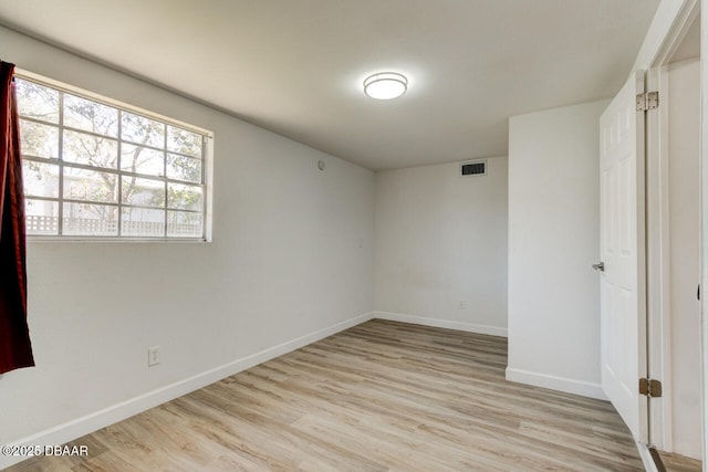 unfurnished room with light hardwood / wood-style flooring