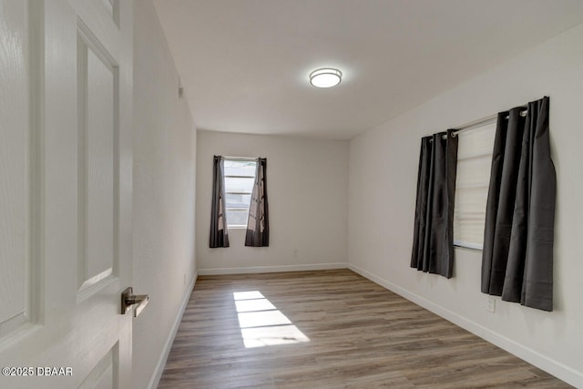 spare room with light hardwood / wood-style floors