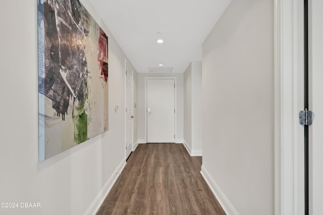 hall with dark hardwood / wood-style flooring