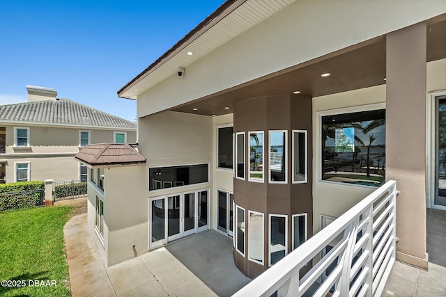 exterior space with fence and stucco siding