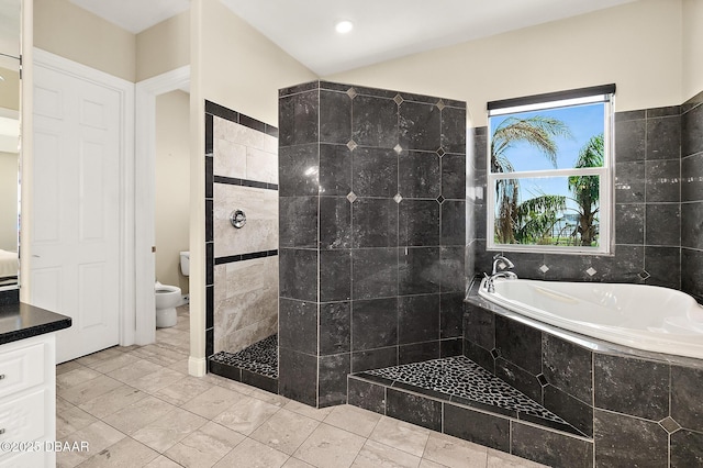 full bath featuring a garden tub, a tile shower, and toilet