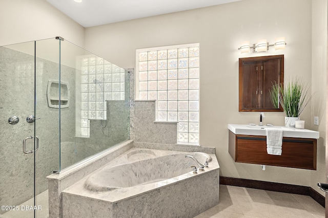 full bath featuring vanity, a stall shower, a bath, and tile patterned flooring