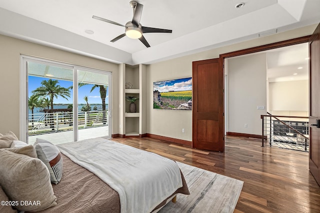 bedroom with access to outside, ceiling fan, baseboards, wood finished floors, and visible vents