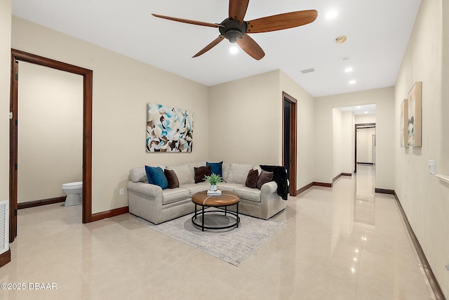 living area with baseboards, recessed lighting, ceiling fan, and light tile patterned floors