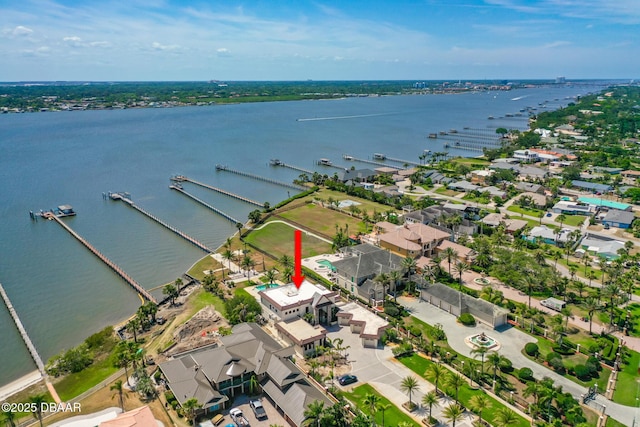 birds eye view of property featuring a water view and a residential view