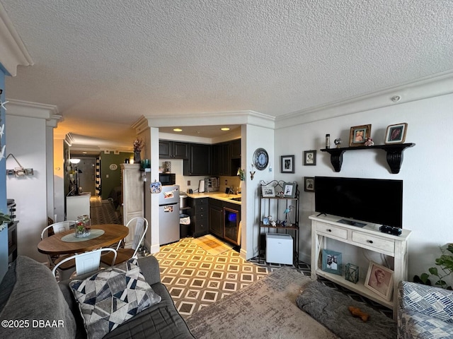 living room featuring wine cooler, recessed lighting, and a textured ceiling