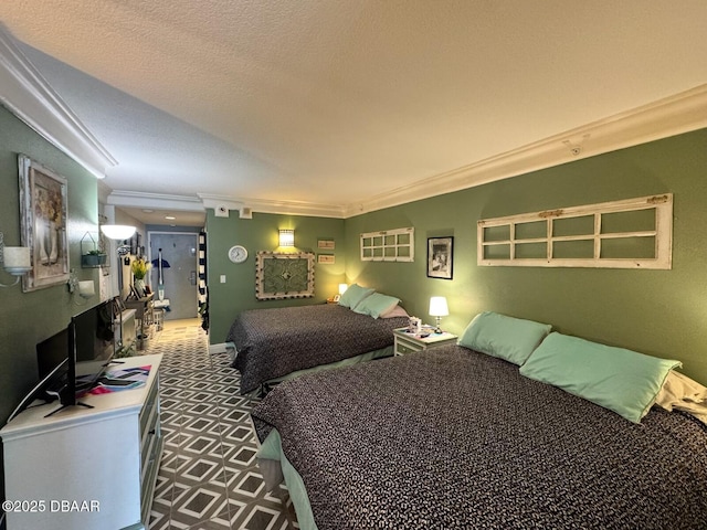 bedroom with a textured ceiling and crown molding