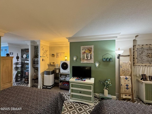 bedroom with crown molding and a textured ceiling