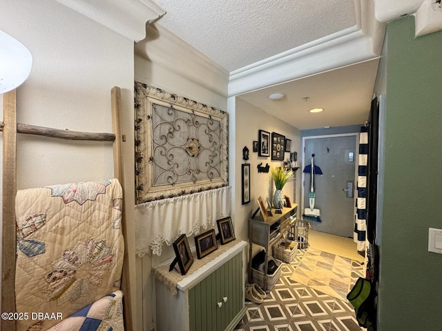 hallway with tile patterned floors and a textured ceiling