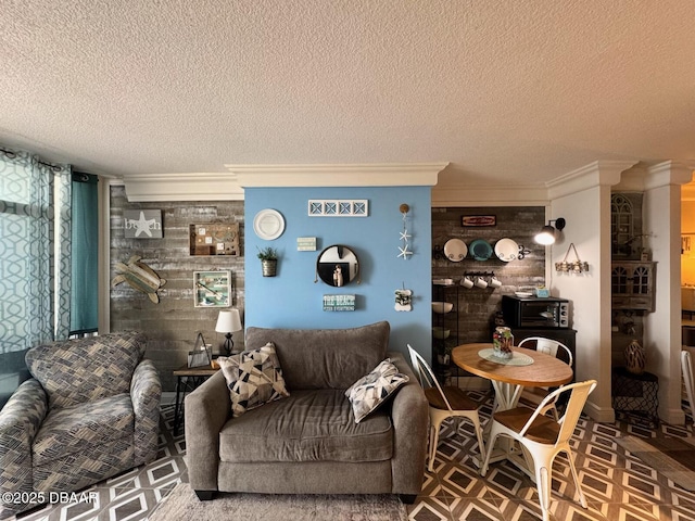 living room featuring a textured ceiling and ornamental molding