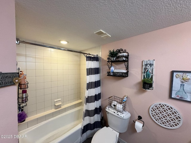 bathroom featuring shower / tub combo, toilet, visible vents, and a textured ceiling