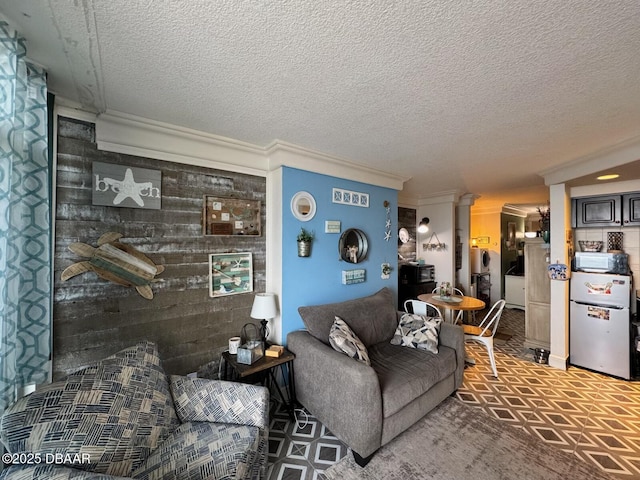 living room with crown molding and a textured ceiling