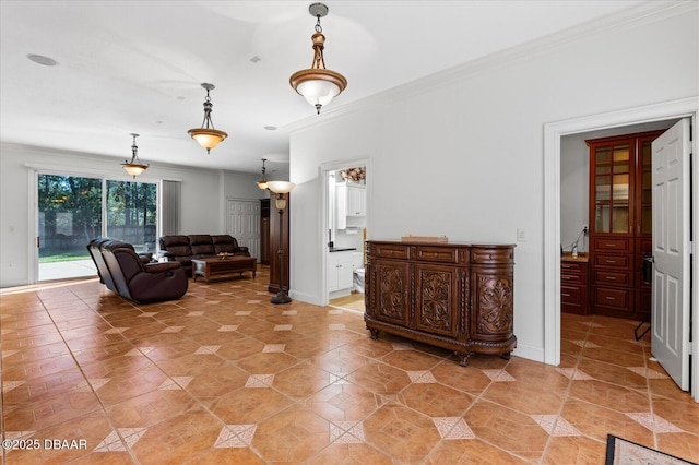 living area featuring ornamental molding, baseboards, and light tile patterned floors