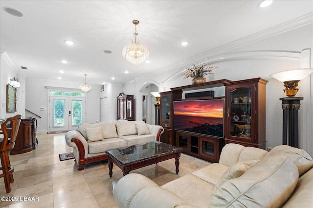 living room with arched walkways, french doors, ornamental molding, and recessed lighting