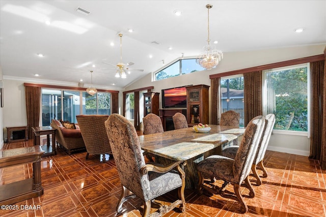 dining room with a chandelier, visible vents, baseboards, vaulted ceiling, and crown molding