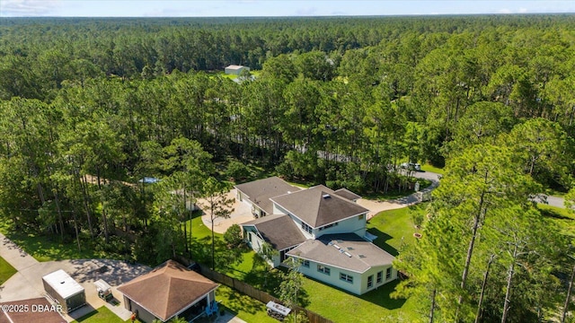 drone / aerial view with a view of trees