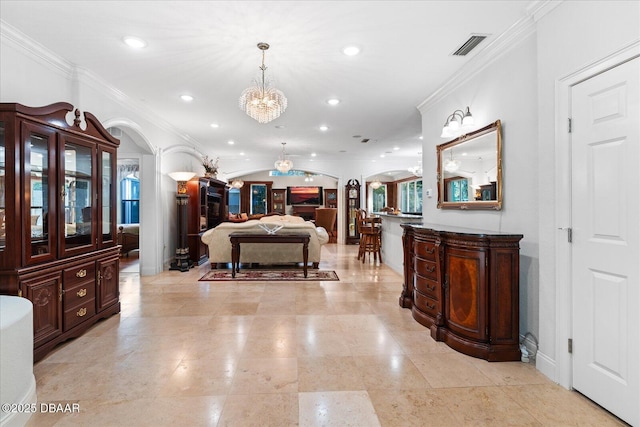 interior space with arched walkways, recessed lighting, a notable chandelier, and crown molding