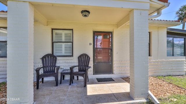 entrance to property with a patio