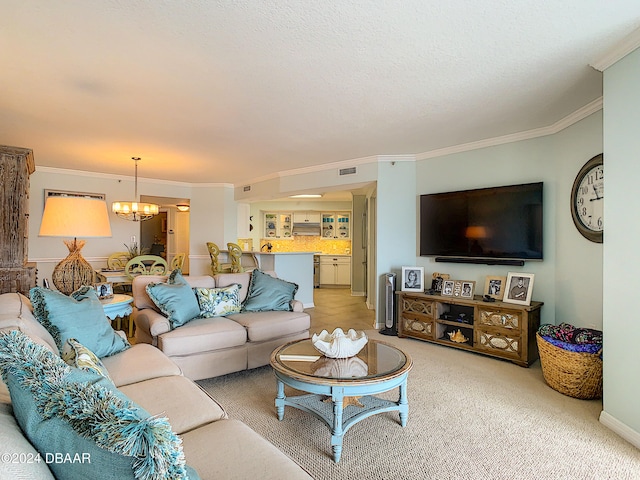 living room featuring a chandelier, carpet floors, and ornamental molding