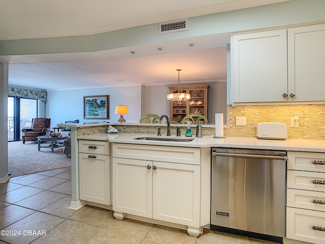 kitchen with sink, kitchen peninsula, decorative light fixtures, dishwasher, and decorative backsplash