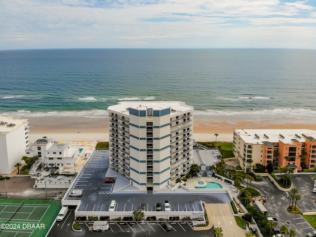 bird's eye view featuring a view of the beach and a water view