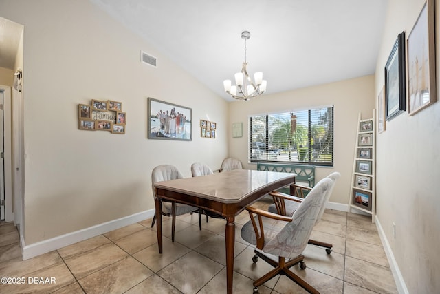 dining space with lofted ceiling, light tile patterned floors, and a chandelier