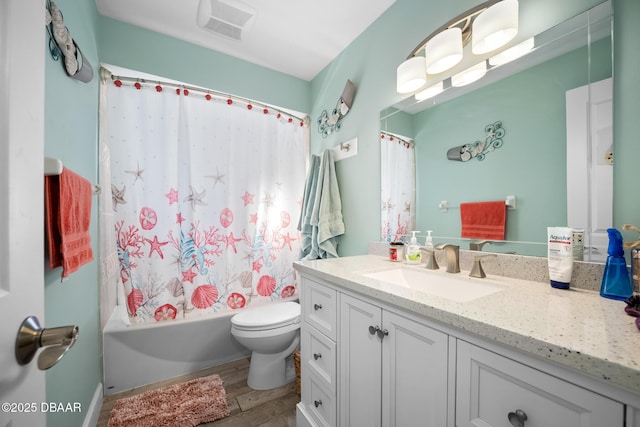 full bathroom featuring vanity, shower / tub combo, wood-type flooring, and toilet