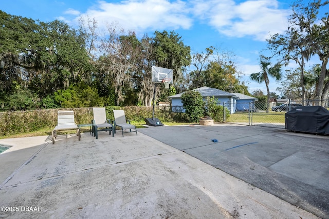 view of patio / terrace with grilling area and basketball court