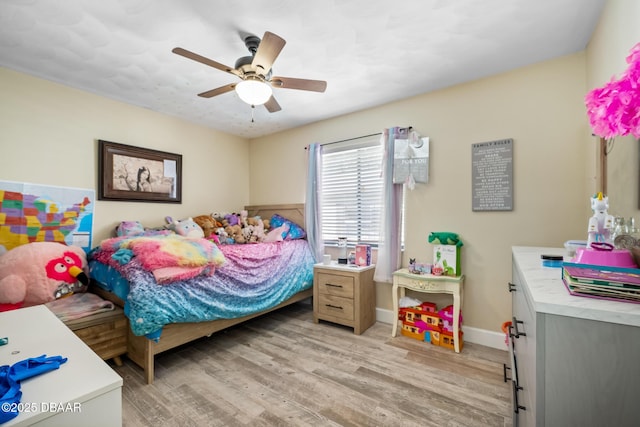 bedroom featuring light hardwood / wood-style flooring and ceiling fan