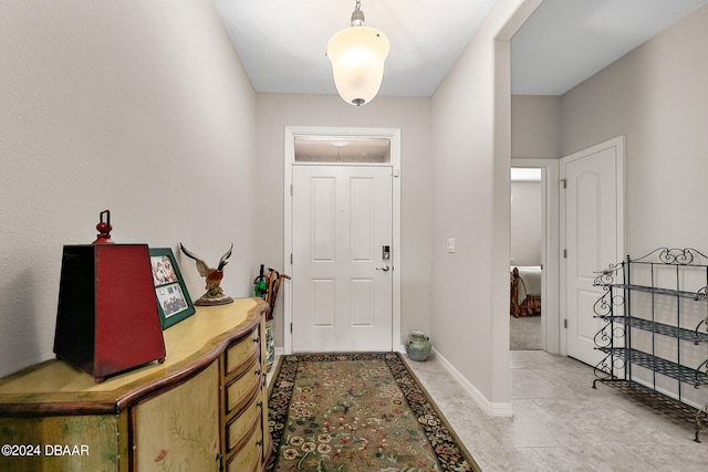 foyer with light tile patterned floors