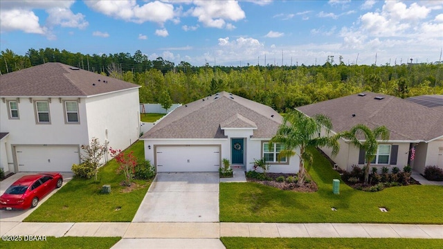 2714 Neverland Dr, New Smyrna Beach, FL 32168 - view of front of house with stucco siding, concrete driveway, a front lawn, and a shingled roof